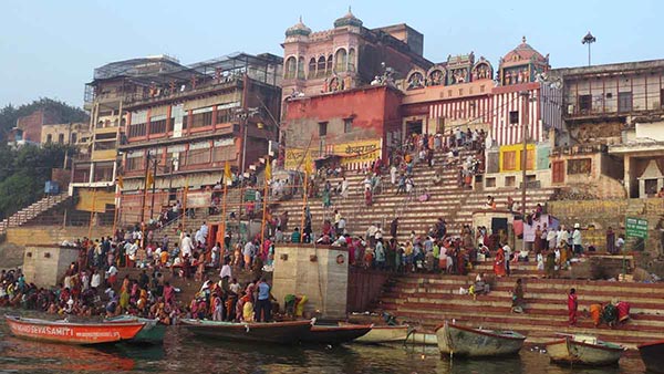 Wide steps crowded with people along the banks of the river