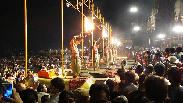 Night scene of priests performing for vast crowds